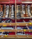 Interior of modern wine boutique store with vintage style wooden luxury showcases.