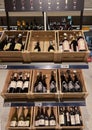 Interior of modern wine boutique store with vintage style wooden luxury showcases.