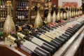 Interior of modern wine boutique store with vintage storefronts with variety sparkling red white wine bottles