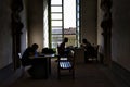 Studying in historic interior of Benedictine Monastery in Catania