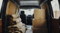 Interior of Moving Van with Cardboard Boxes and Blankets for Relocation Royalty Free Stock Photo