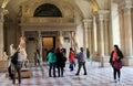 Interior of museum, with travelers admiring masterpieces, The Louvre,Paris,France,2016