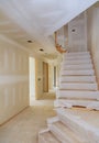 Interior new home construction of housing project with drywall installed Royalty Free Stock Photo