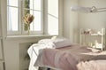 Beautician& x27;s office, massage salon or spa room with empty bed covered with towels Royalty Free Stock Photo