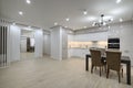 Interior of new spacious white kitchen after renovation in studio apartmen Royalty Free Stock Photo