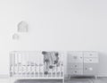 Interior of a newborn room, white bedroom design with baby crib