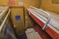Interior of night train with beds and wash basin Royalty Free Stock Photo