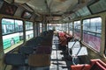 Interior of an Old Abandoned Bus with Vintage Seats Royalty Free Stock Photo