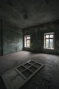 Interior of an old abandoned rooms, a lot of garbage, old furniture and antiquities destroyed, rooms need repair, old dust and