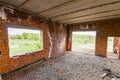 Interior of an old building under construction. Orange brick walls in a new house. Royalty Free Stock Photo