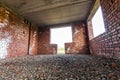 Interior of an old building under construction. Orange brick walls in a new house. Royalty Free Stock Photo