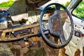 Interior of old car with the steering wheel and dashboard,Steering wheel inside an old rusted truck on the side of a highway