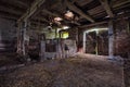 Interior of an old, decaying barn.