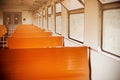 The interior of an old empty retro train car with orange seats. Blurred background inside the train. Traveling alone Royalty Free Stock Photo
