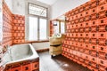 Bathroom with bright tiles in old apartment Royalty Free Stock Photo