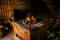 Interior of an old forge. Bright fire burning in the furnace Royalty Free Stock Photo