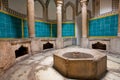 Interior of an old hamam bath with columns and a tiled swimming pool in the Persian style