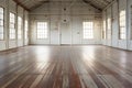 Interior of an old industrial building with wooden floor and large windows Royalty Free Stock Photo