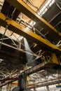 The interior of an old manufacturing plant. Large hangar in a factory with many special machines and technological Royalty Free Stock Photo