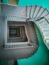 Interior of old renovated wooden square spiral staircase Royalty Free Stock Photo