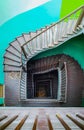 Interior of old renovated wooden square spiral staircase Royalty Free Stock Photo