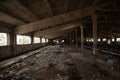 Interior of the old ruined abandoned barn for cows. Destroyed agriculture Royalty Free Stock Photo