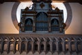 Interior of an old wooden church with the view of balcony and pipe organ Royalty Free Stock Photo