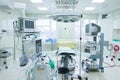 Interior of operating room in modern clinic. Hospital details - Modern surgery room with technology and lamps.