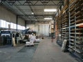 Interior of a paper and cardboard factory, die-cutting department. Packaging.