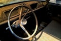 An interior in the dust. One old abandoned car. Royalty Free Stock Photo