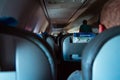 Interior of passenger airplane with people on seats Royalty Free Stock Photo