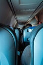 Interior of passenger airplane with people on seats Royalty Free Stock Photo