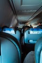 Interior of passenger airplane with people on seats Royalty Free Stock Photo