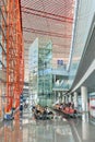 Interior with passenger seats and elevator, Beijing Capital International Airport. Royalty Free Stock Photo