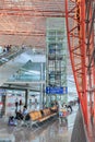 Interior with passenger seats and elevator, Beijing Capital International Airport. Royalty Free Stock Photo