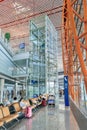 Interior with passenger seats and elevator, Beijing Capital International Airport. Royalty Free Stock Photo