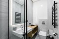Interior photo, small bathroom, with white marble tiles, and shower Royalty Free Stock Photo