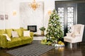 Interior photo studio with Christmas decor. Fireplace, Christmas tree, gifts of the New Year`s scenery