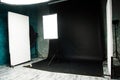 The interior of the photo studio. Preparing to work with photographic equipment. Black cyclorama, exposure to light on the octobox