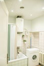 Interior photography, bathroom. Tidy white bathroom for convenient living. City accomodations interior.