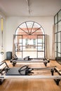 Interior of a Pilates gym with reformer beds