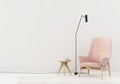 Interior with a pink armchair and wooden table