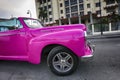 pink American classic cars are often used as taxis for tourists in Havana Royalty Free Stock Photo