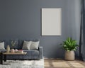 Interior poster mockup with vertical empty wooden frame standing on wooden floor with sofa on dark background Royalty Free Stock Photo
