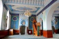 Interior prayer area with blue calligraphy mihrab columns Jumah Central Mosque Tbilisi Georgia