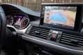 Interior of premium car with rearview camera dynamic trajectory turning lines and parking assistant. Driver assistance