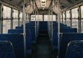 Empty Public Transportation Interior View from Back Rows of Blue Seats and Windows Royalty Free Stock Photo