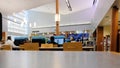 Interior of a public library with patrons using computer terminals