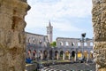 Interior of Pula Arena, the only remaining Roman amphitheatre entirely preserved, with the tower of the Church of St Anthony at