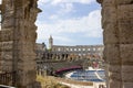 Interior of Pula Arena, the only remaining Roman amphitheatre entirely preserved, with the tower of the Church of St Anthony at